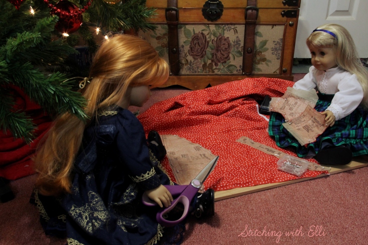 The dolls are sewing a dress for a Christmas present-  by Stitching with Elli